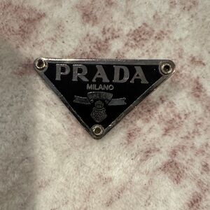 Prada Triangular Black and Silver Emblem